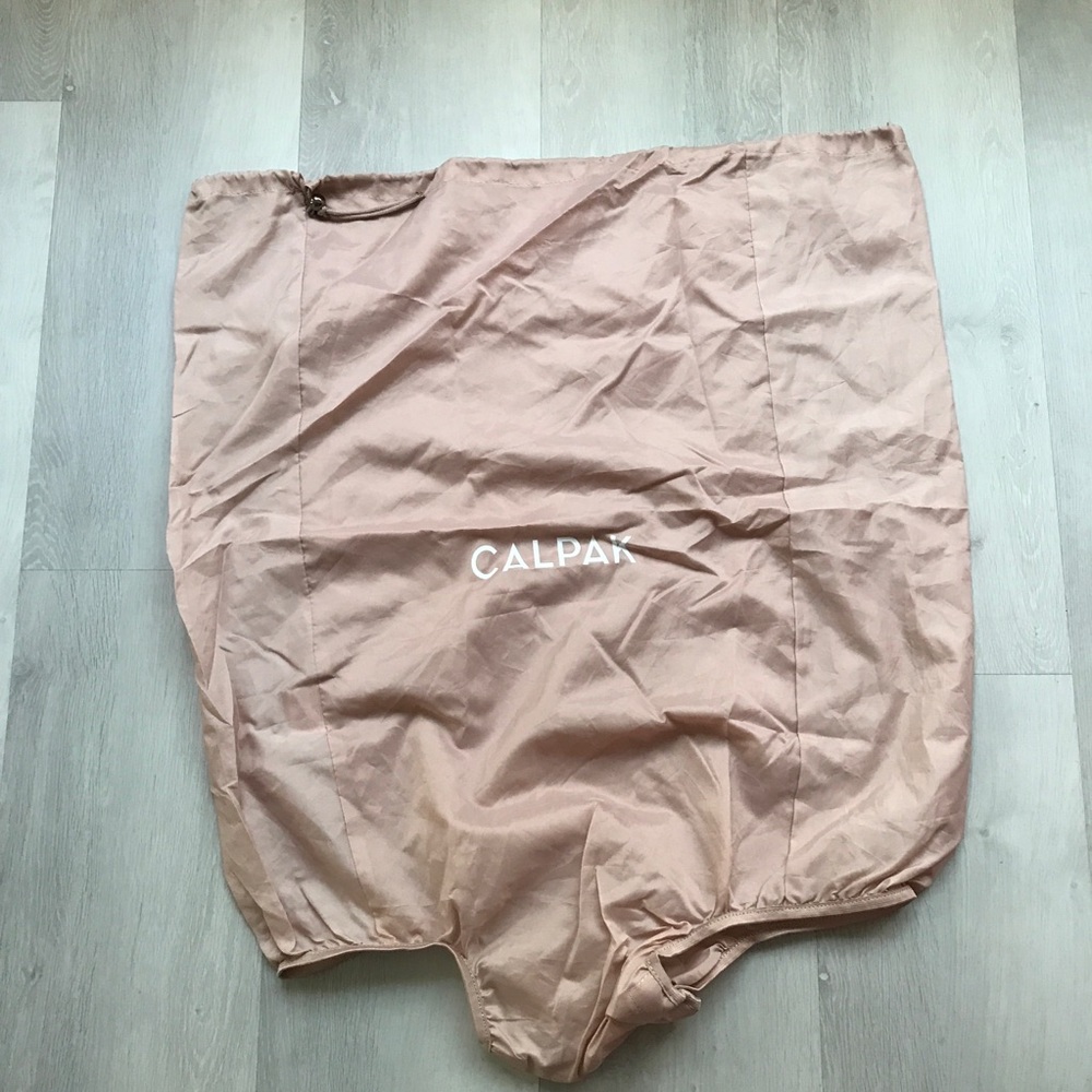 CALPAK PINK LUGGAGE COVER LARGE TRAVEL SIZE